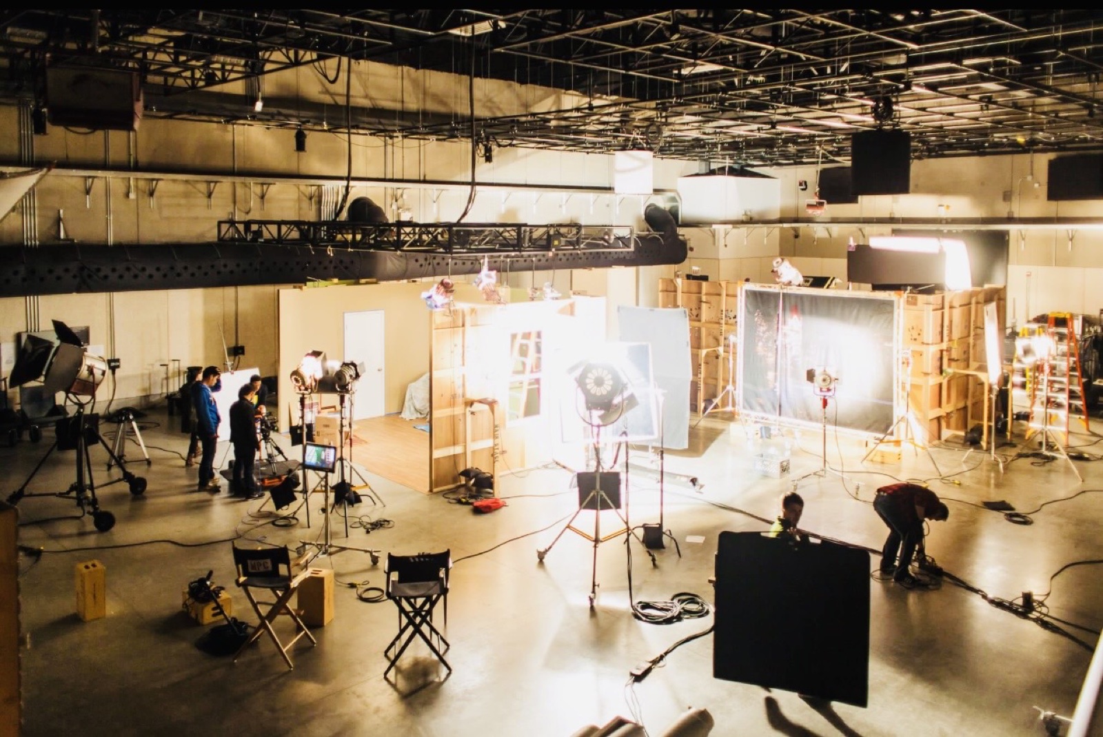 Soundstage at the film studio with active production lighting and crew